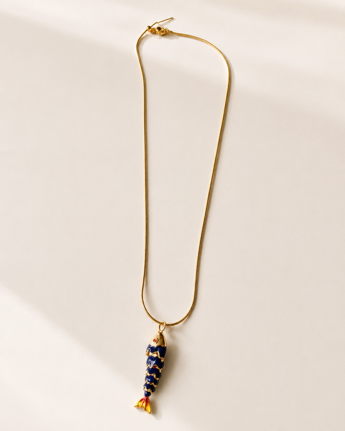 the navy fish necklace